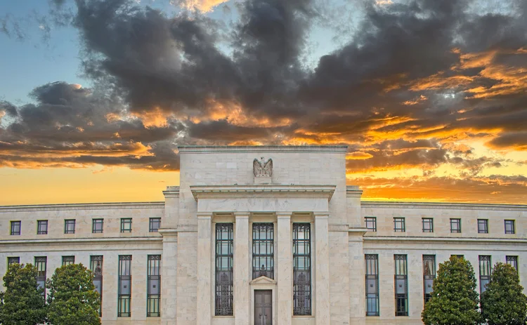 Federal Reserve with a dramatic cloudy background