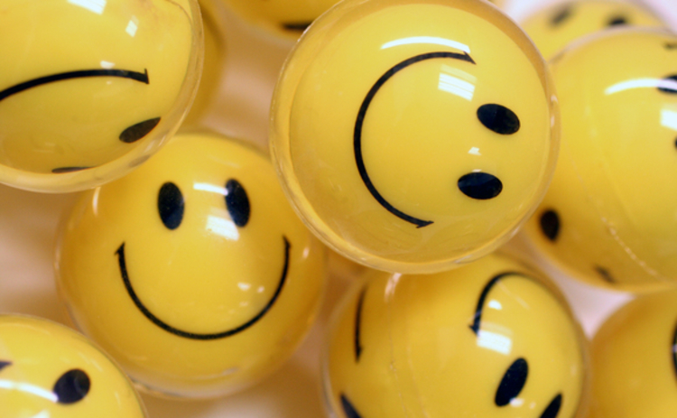 Concept image of yellow smiley face balls