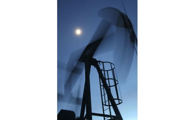 canada-alberta-oil-rig-in-action-blurred-at-night-with-moon