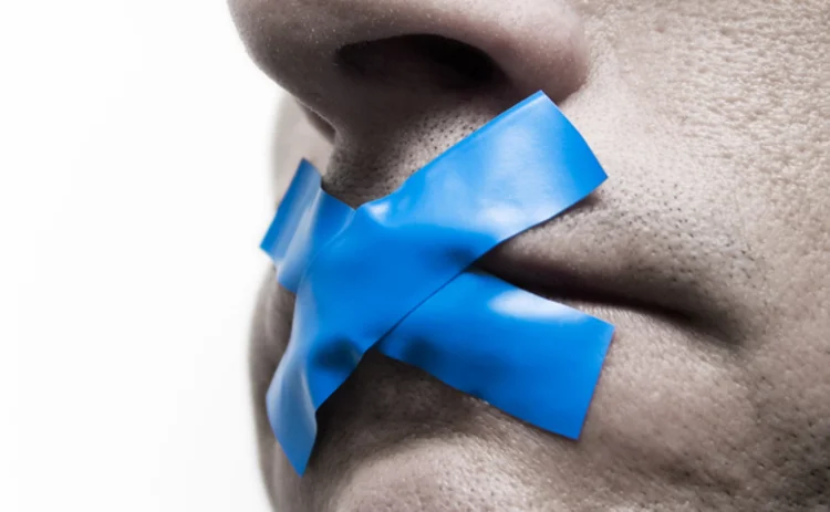 Blue tape on mouth as gag