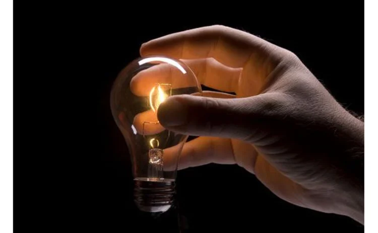 hand-holding-lit-lightbulb