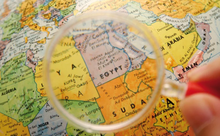 Egypt and Sudan on a globe under a magnifying glass