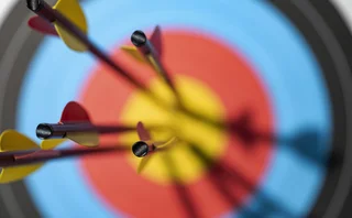 Arrows in the bull’s-eye of an archery target