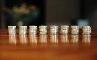 Equal stacks of coins in a row