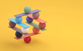 Balls are balancing on various tiered coloured planks