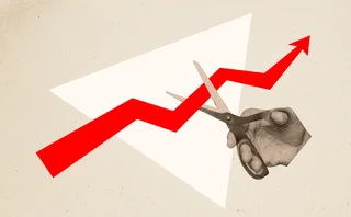 Scissors cutting an arrow on a chart - abstract image 