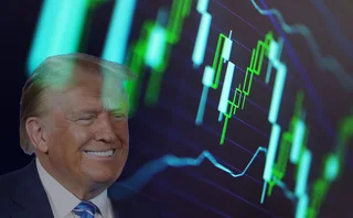 Donald Trump grinning at a market graph