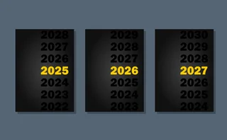 Three black-covered report booklets, with a yellow date on each: 2025, 2026 and 2027