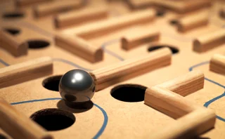 A ball in a maze, and the maze also has holes the ball could drop through