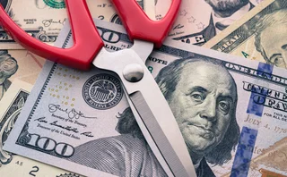 Scissors on top of US dollars