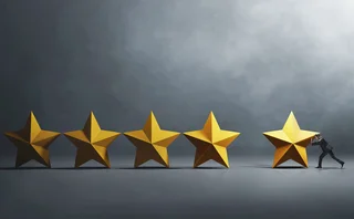Businessperson pushes a 3D rendition of a star next to four others, to create a five-star review