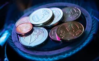 Euro coins on gas hob