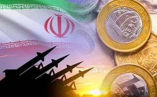 Montage of Iran flag with rocket launchers pointed at EM currencies