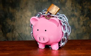 a piggy bank in chains