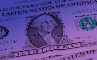 US dollar banknote with a crease down the middle giving the impression of George Washington smiling