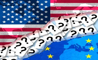 EU and US flags are separated by a rift consisting of many question marks