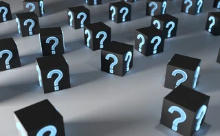 3D rendering of black boxes covered in glowing blue question marks