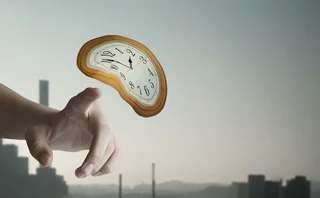 Illustration of a finger moving towards a wobbly clock face that is floating through the air