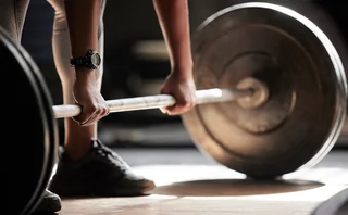 A weight-lifter lifting barbells