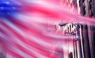Blurred US flag on Wall Street