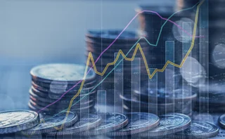 Double exposure of graph and stack of coins 