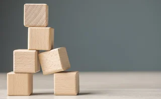 Unstable pile of wooden blocks