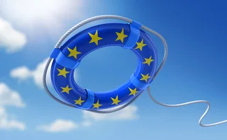 A life belt with the EU flag styling on it is being thrown into the water