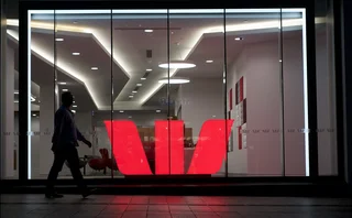 Westpac logo illuminated in a glass window