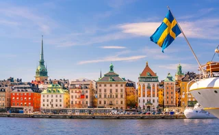 Stockholm old town and flag
