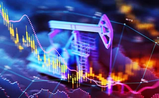 Computerised illustration of oilrigs overlaid on financial data charts