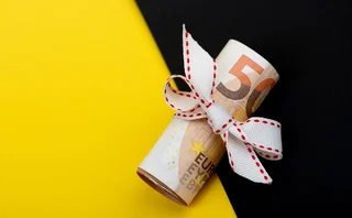Euro notes are wrapped with string