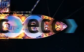 Overhead image of LNG tanker overlaid with clearing house European Commodity Clearing’s logo