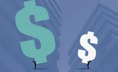 Two figures holding different sized dollar symbols in front of business buildings