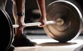 A weight-lifter lifting barbells