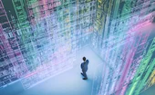 Businessman standing in VR environment, looking uncertain of what to do with the vast information in front of him
