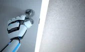 A humanoid robot’s hand opens a door 