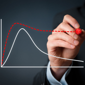 Two lines are seen on a graph. On ehas a steep drop, but the other, which has been drawn on by a hand, has a much smoother descent