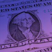US dollar banknote with a crease down the middle giving the impression of George Washington smiling