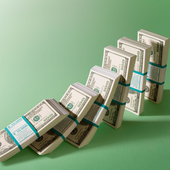 Bundles of dollars falling like dominoes