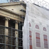 Scaffolding on the Palace of the University of Bucharest’s facade is half-covered by an idealised version printed on a sheet